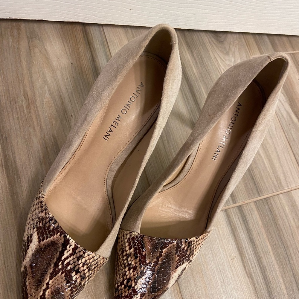 Size 8.5 Snakeskin heels with leather upper. Never worn.